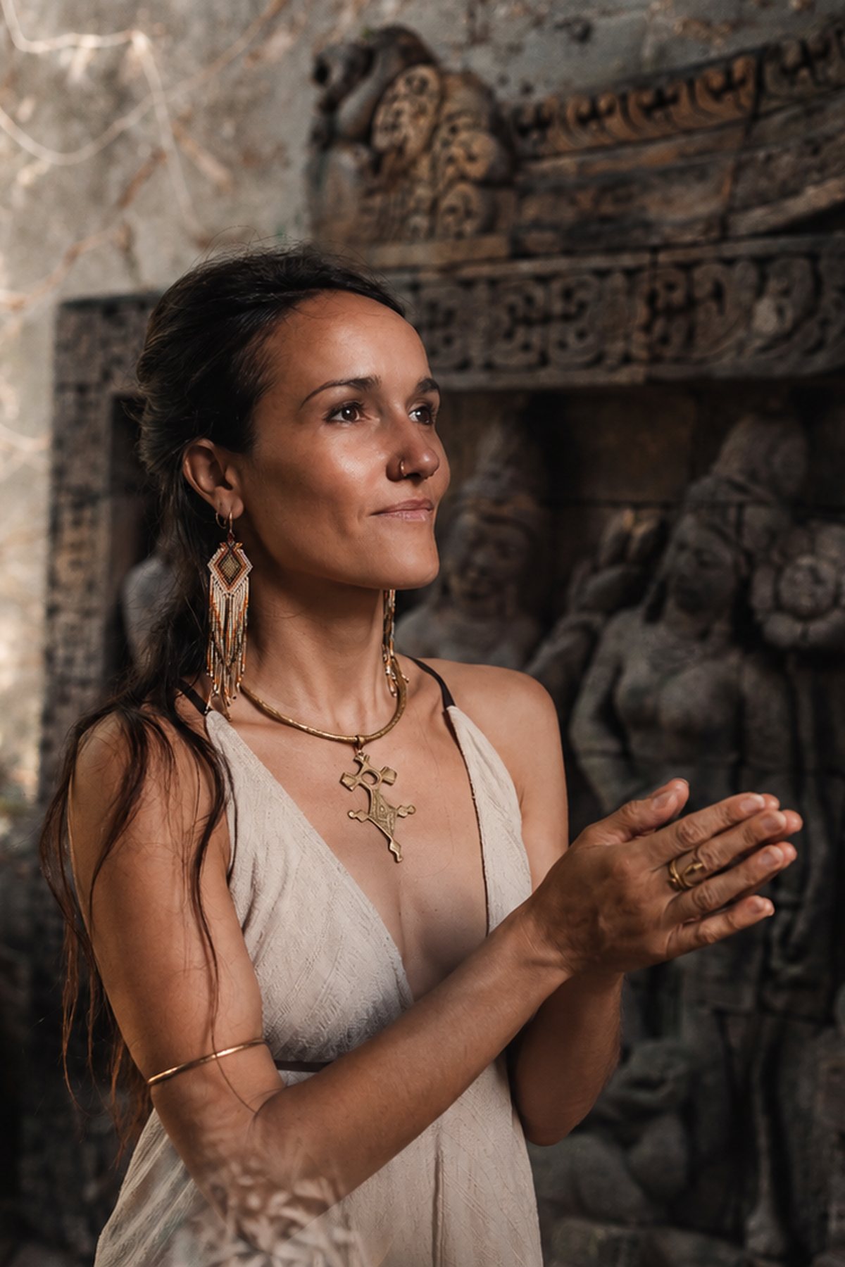 Pao Pamaki with hands in prayer at a Bali temple