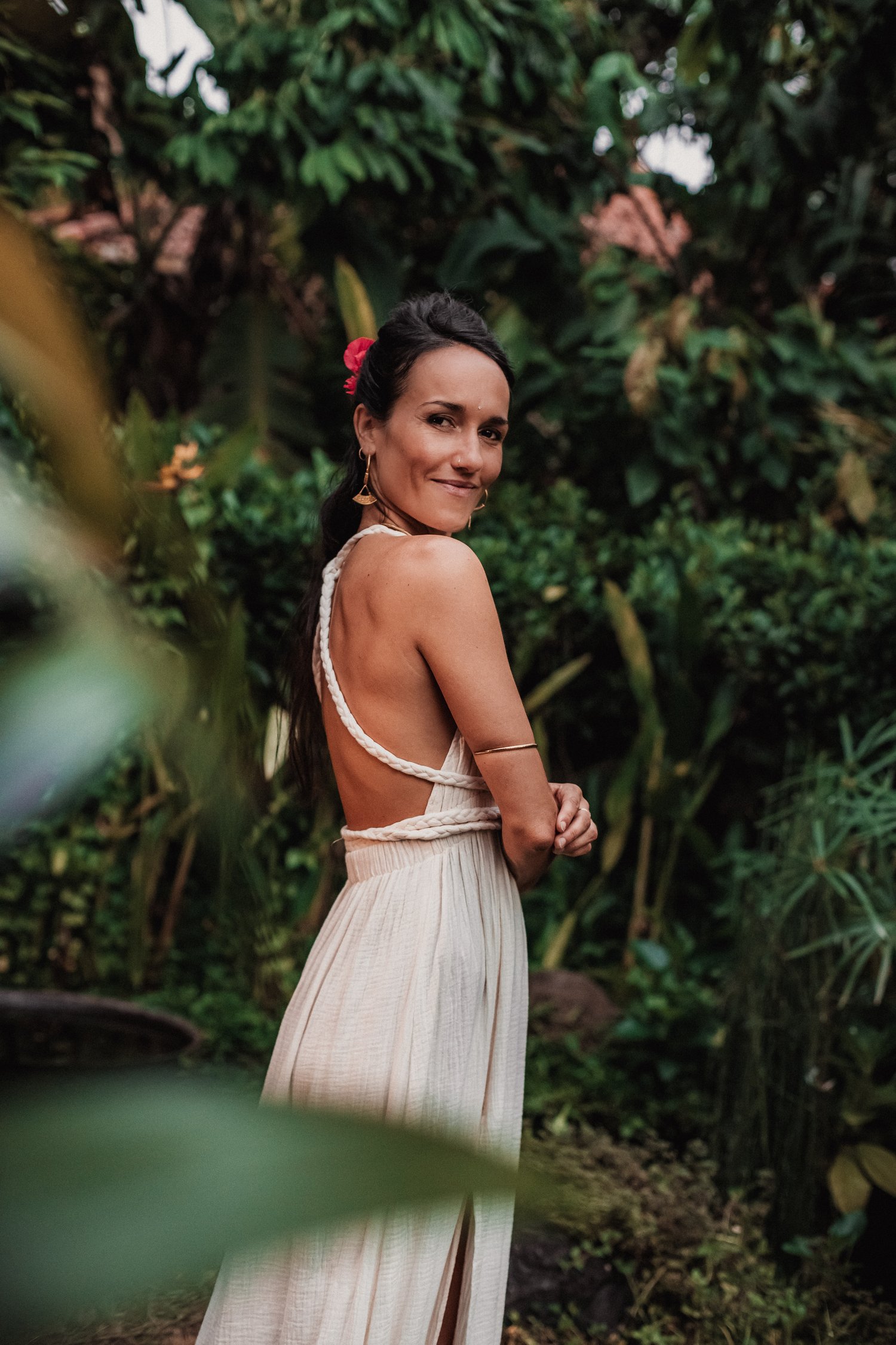 Pao Pamaki walking through a Bali garden