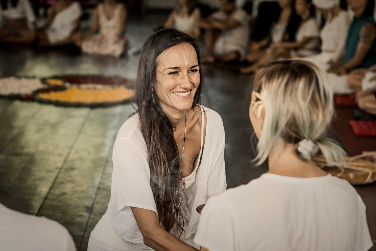Pao Pamaki laughing with a participant during a workshop